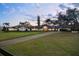 Expansive single story home featuring a circular driveway and lush, well-manicured front lawn at 4154 Equestrian Ln, Windermere, FL 34786