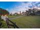 Expansive single story home featuring a circular driveway and lush, well-manicured front lawn at 4154 Equestrian Ln, Windermere, FL 34786