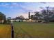 Expansive single story home featuring a circular driveway and lush, well-manicured front lawn at 4154 Equestrian Ln, Windermere, FL 34786