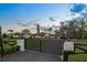Elegant estate with a gated entrance and lush landscaping, offering privacy and curb appeal at 4154 Equestrian Ln, Windermere, FL 34786