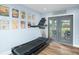 Home gym featuring a treadmill and french doors to the patio at 4154 Equestrian Ln, Windermere, FL 34786