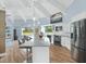 Modern kitchen with stainless steel appliances, pendant lights, and an open design at 4154 Equestrian Ln, Windermere, FL 34786