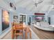 Open-concept living space with vaulted ceilings, dining area, and comfortable seating at 4154 Equestrian Ln, Windermere, FL 34786