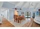Open-concept living room featuring vaulted ceilings, a dining area, and access to outdoor spaces at 4154 Equestrian Ln, Windermere, FL 34786