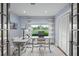 Bright office with two desks, stylish chairs, and an open view to the outdoors at 4154 Equestrian Ln, Windermere, FL 34786