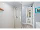 Modern walk-in shower with tile surround and glass door, adjacent to the pool entry door at 4154 Equestrian Ln, Windermere, FL 34786