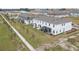 Community view showing multiple townhomes and a pool at 4298 Campsite Loop, Orlando, FL 32824