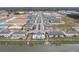 Aerial view of a new home community with lake access and a community pool at 4298 Campsite Loop, Orlando, FL 32824
