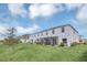 Townhome with grassy backyard and trees at 4298 Campsite Loop, Orlando, FL 32824