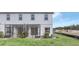 Screened patio and grassy backyard at 4298 Campsite Loop, Orlando, FL 32824