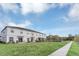 Townhome with grassy backyard and sidewalk at 4298 Campsite Loop, Orlando, FL 32824