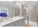 Modern bathroom with double sinks and a glass shower at 4298 Campsite Loop, Orlando, FL 32824