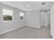 Bright room with neutral carpet, two windows, and ample space for a comfortable setup at 4298 Campsite Loop, Orlando, FL 32824