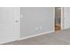 Bedroom with grey walls, white base trim, carpet and a closet that opens to an ensuite bathroom at 4298 Campsite Loop, Orlando, FL 32824