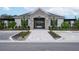 Exterior view of the community clubhouse with stone entrance and manicured landscaping at 4298 Campsite Loop, Orlando, FL 32824
