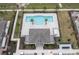 Community pool and clubhouse with surrounding landscaping at 4298 Campsite Loop, Orlando, FL 32824