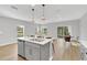 Modern kitchen with stainless steel appliances and an island at 4298 Campsite Loop, Orlando, FL 32824