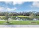 Scenic view of a lake with lush green grass and trees at 4298 Campsite Loop, Orlando, FL 32824