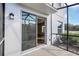View of lanai with sliding glass doors leading to the interior of the property at 4298 Campsite Loop, Orlando, FL 32824