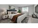 Comfortable main bedroom featuring a plush bed, stylish furnishings, and abundant natural light at 4298 Campsite Loop, Orlando, FL 32824