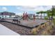 playground with play equipment and benches at 4298 Campsite Loop, Orlando, FL 32824