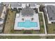 Aerial view of community pool with surrounding patio and landscaping at 4298 Campsite Loop, Orlando, FL 32824