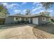 Charming home featuring a two-car garage and well-manicured front yard at 4680 Carmel St, Orlando, FL 32808