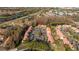 Aerial view of condominium buildings with parking and view of community at 4765 Capri Pl # 209, Orlando, FL 32811