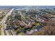 Aerial view of townhomes close to commercial buildings, lakes, and parkways at 4765 Capri Pl # 209, Orlando, FL 32811