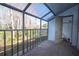Enclosed balcony with views of a wooded area at 4765 Capri Pl # 209, Orlando, FL 32811