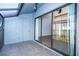 View from enclosed balcony into the home's living room at 4765 Capri Pl # 209, Orlando, FL 32811