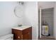 Bathroom with updated vanity, sink, toilet, and closet for water heater and storage at 4765 Capri Pl # 209, Orlando, FL 32811