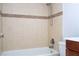 Bathroom view includes a tub with tile surround and a toilet next to a dark wood vanity at 4765 Capri Pl # 209, Orlando, FL 32811