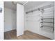 Walk-in closet with wire shelving and door for storage at 4765 Capri Pl # 209, Orlando, FL 32811