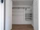 Walk-in closet with wire shelving and door for storing clothing at 4765 Capri Pl # 209, Orlando, FL 32811