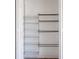 Open white closet displaying white and silver shelving at 4765 Capri Pl # 209, Orlando, FL 32811