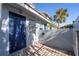 Exterior of a front door and enclosed patio with paver flooring at 4765 Capri Pl # 209, Orlando, FL 32811