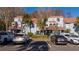 Well maintained two-story townhome with a tile roof, reserved parking, and mature landscaping at 4765 Capri Pl # 209, Orlando, FL 32811