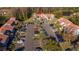 Exterior aerial shot of the property with a parking lot, landscaping and nice community at 4765 Capri Pl # 209, Orlando, FL 32811