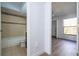Hallway view includes a bathroom and leads to a light and bright bedroom at 4765 Capri Pl # 209, Orlando, FL 32811