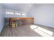Loft area with railing overlooking the living room and three windows at 4765 Capri Pl # 209, Orlando, FL 32811
