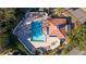 Aerial view of a community pool featuring lounge chairs on a brick patio at 4765 Capri Pl # 209, Orlando, FL 32811