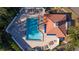 Aerial view of the large in-ground pool and sunning deck with lounge chairs at 4765 Capri Pl # 209, Orlando, FL 32811