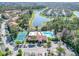Community pool, tennis court, and parking area at 5144 Conroy Rd # 35, Orlando, FL 32811