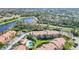 Condos, pool, and parking area near a lake at 5144 Conroy Rd # 35, Orlando, FL 32811
