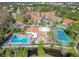 Community overview showing pool, tennis court, and building at 5144 Conroy Rd # 35, Orlando, FL 32811