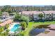 Community pool and surrounding condos with lush landscaping at 5144 Conroy Rd # 35, Orlando, FL 32811