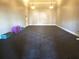 Large, carpeted aerobics room with plenty of open space for workouts at 5144 Conroy Rd # 35, Orlando, FL 32811