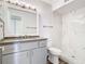 Updated bathroom with gray vanity and marble shower at 5144 Conroy Rd # 35, Orlando, FL 32811