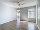 Spacious bedroom featuring a large window and ceiling fan at 5144 Conroy Rd # 35, Orlando, FL 32811